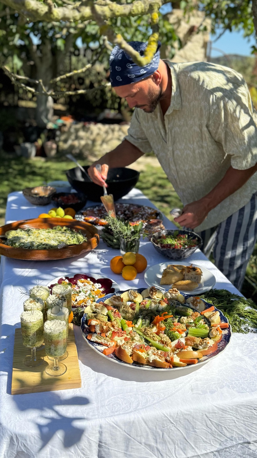 Chef preparing a generous outdoor lunch in a private villa setting